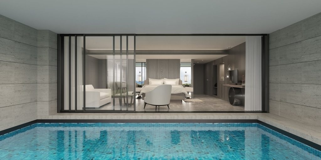Casa com estilo minimalista. Vista para piscina e sala de estar.